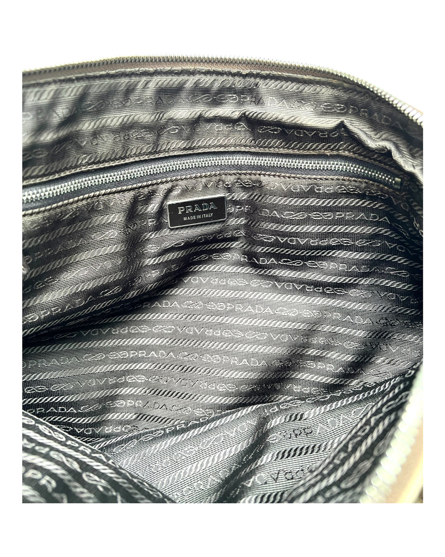 Vintage Prada Beige Canapa Canvas Bag with Lime Green Leather Trim. Image depicts the inside of the bag which features a black logo lining