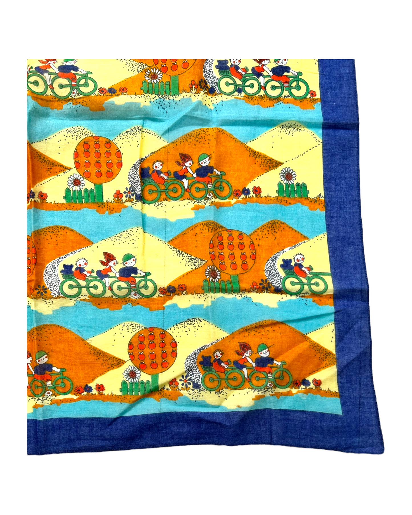Vintage Blue, Yellow and Orange Cotton Bandana Scarf. Scarf depicts a repeated image of kids biking against a mountain background.