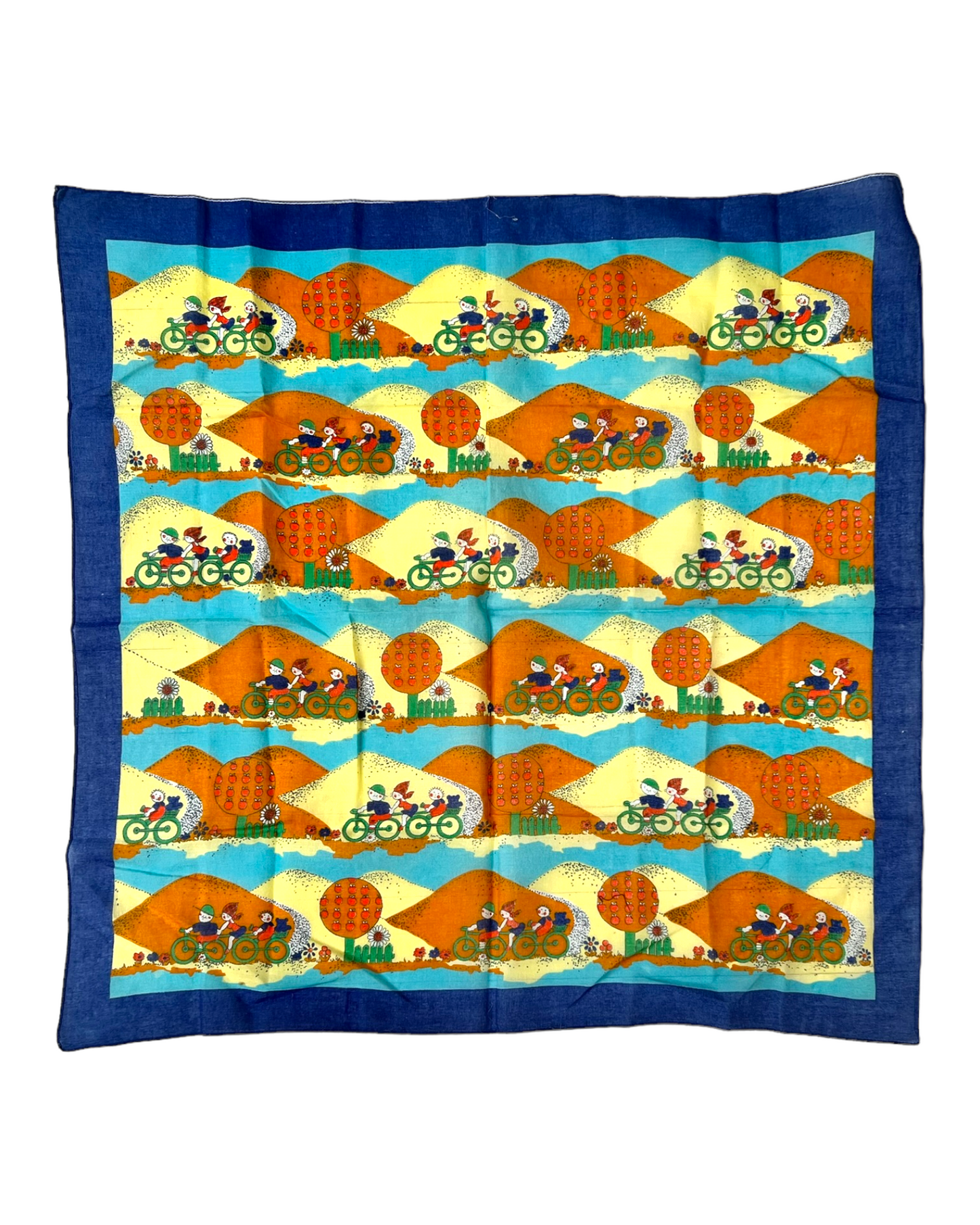 Vintage Blue, Yellow and Orange Cotton Bandana Scarf. Scarf depicts a repeated image of kids biking against a mountain background.