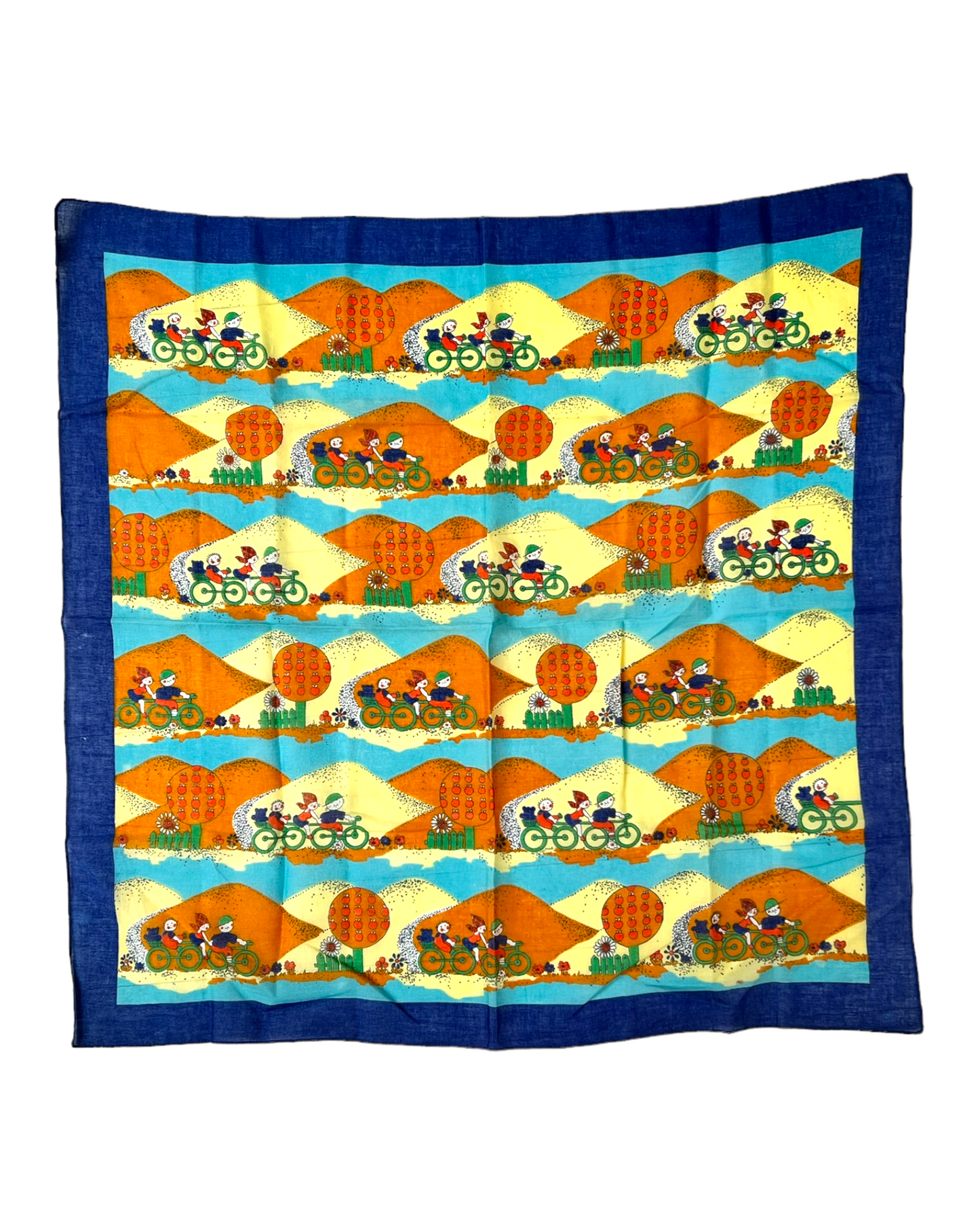 Vintage Blue, Yellow and Orange Cotton Bandana Scarf. Scarf depicts a repeated image of kids biking against a mountain background.
