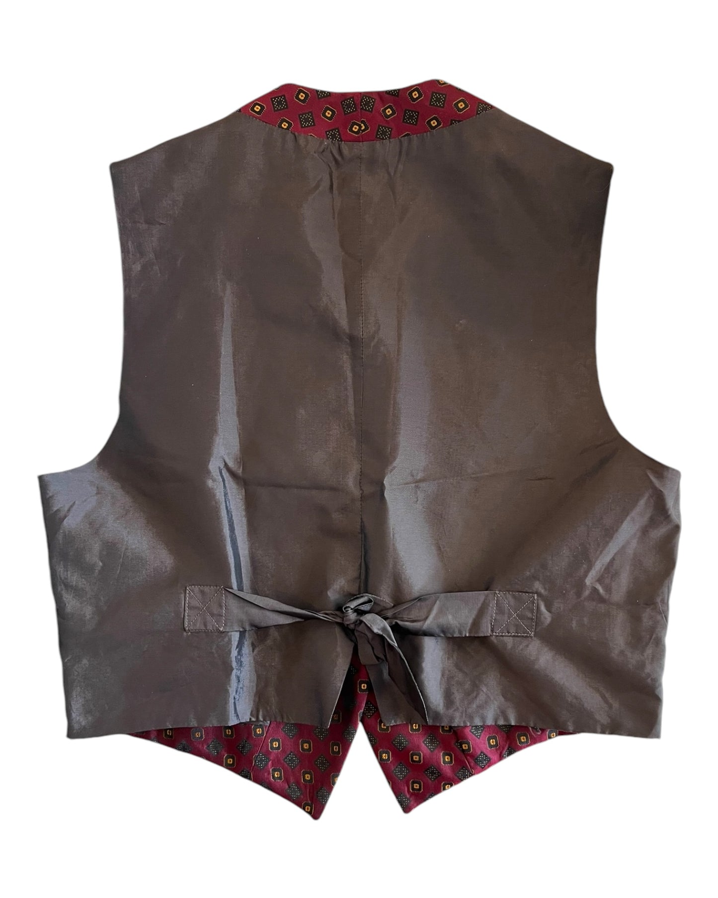 Vintage Romeo Gigli Burgundy and Gold Silk Vest. Vest is waist length and features a repeating geometric pattern. image depicts the back of the vest, which is black.