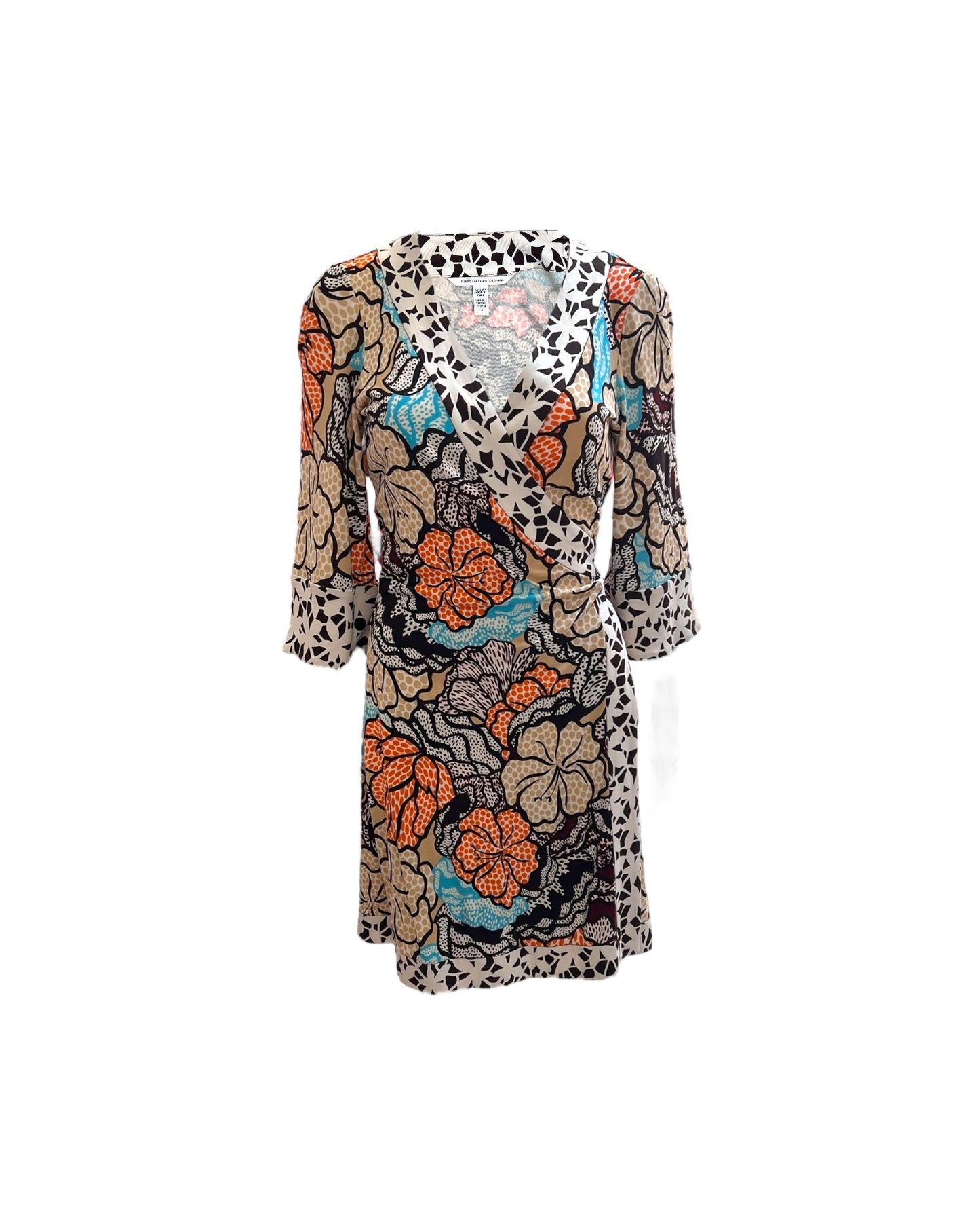 A vintage Diane Von Furstenberg Hawaiian print silk mini wrap dress with a multicolored floral pattern.
