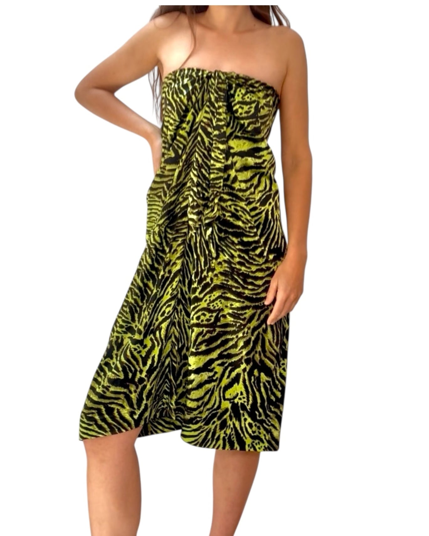 Woman wearing a strapless dress with a zebra pattern on a white background