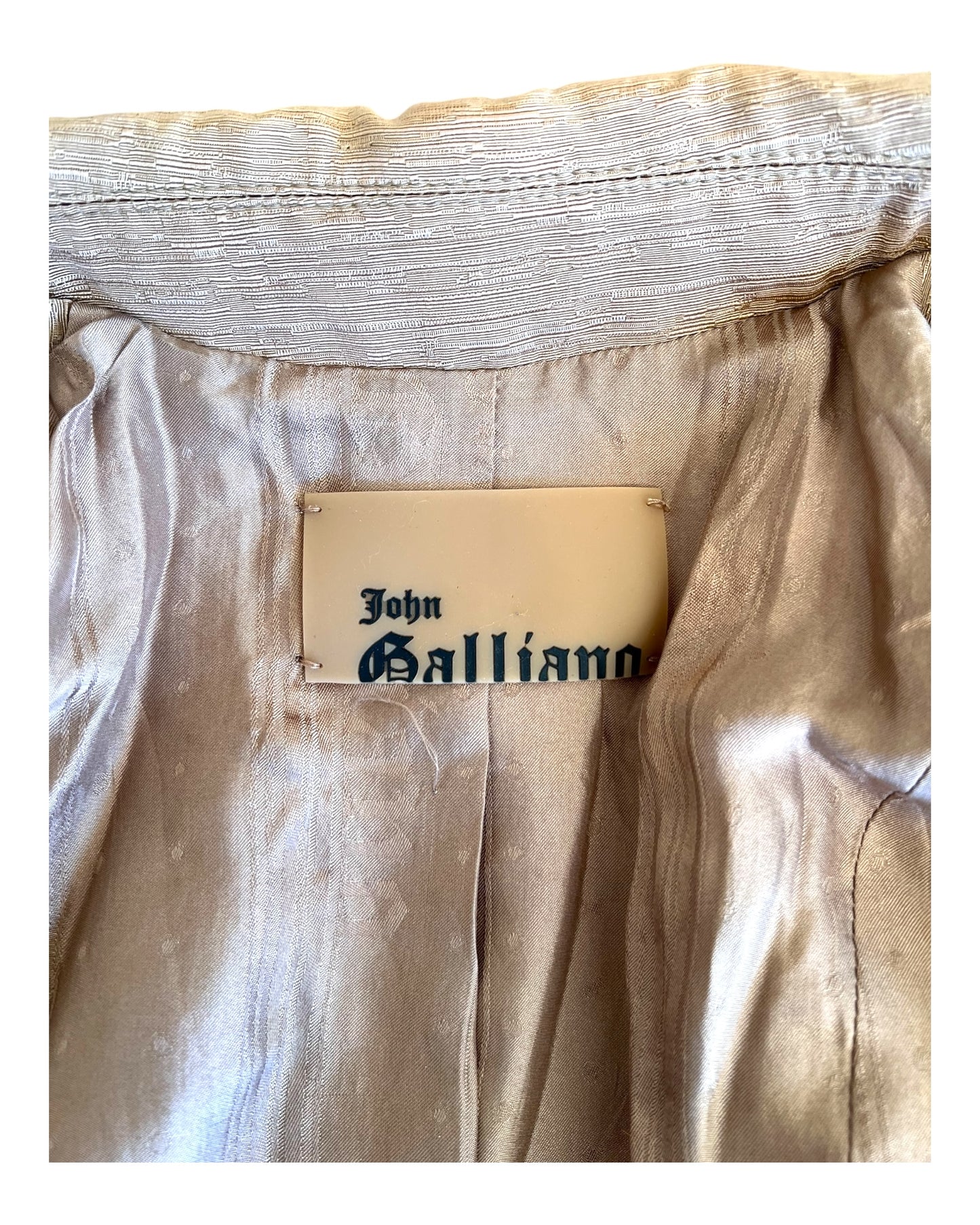 Vintage 2005 John Galliano Cropped Tan Jacket with Fur Trim. Image shows brand tag.