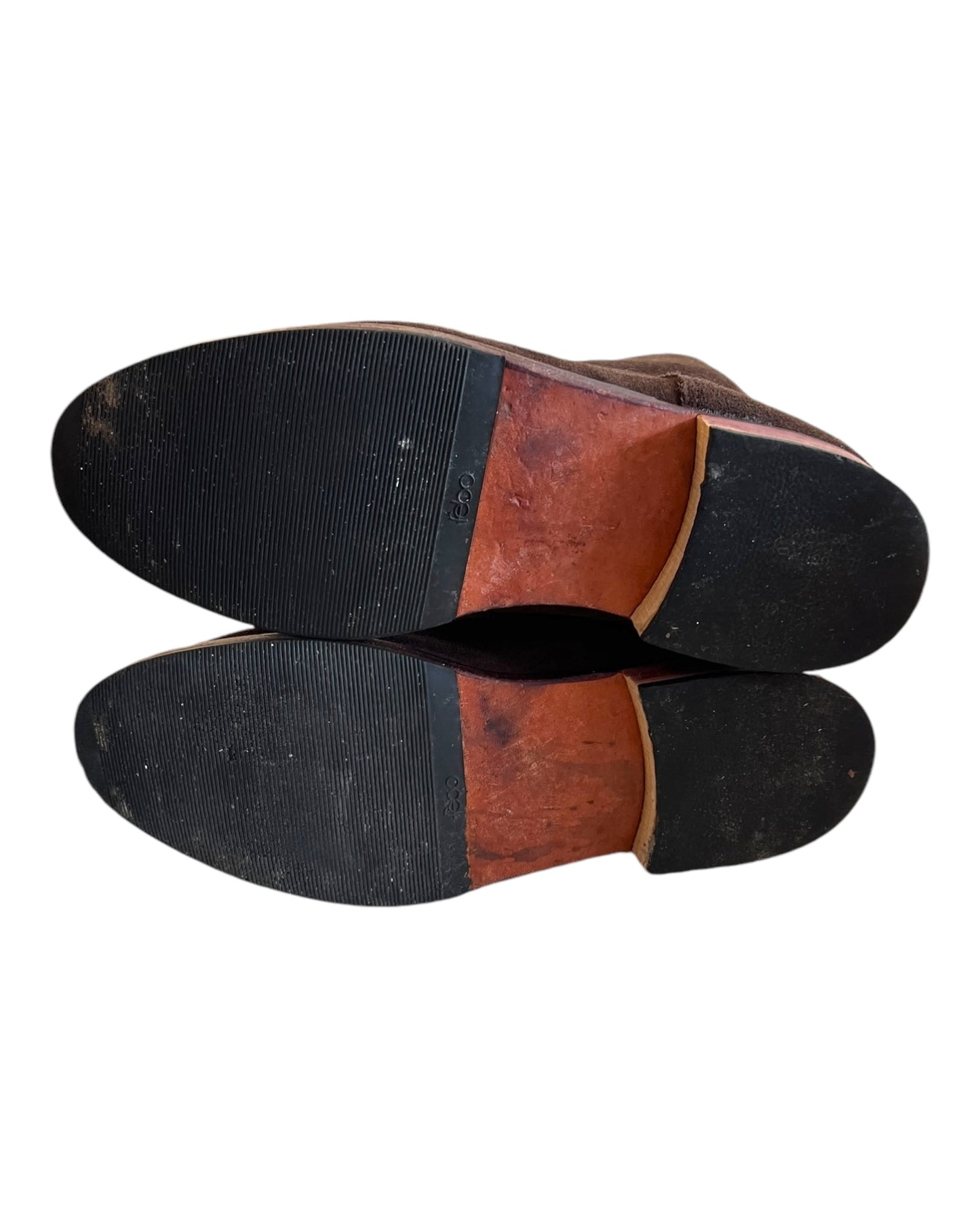 Vintage Chocolate Brown Suede Argentine Riding Boots. Features rounded toe and are mid to high calf height. Image depicts the bottom of the shoes, showing light wear.