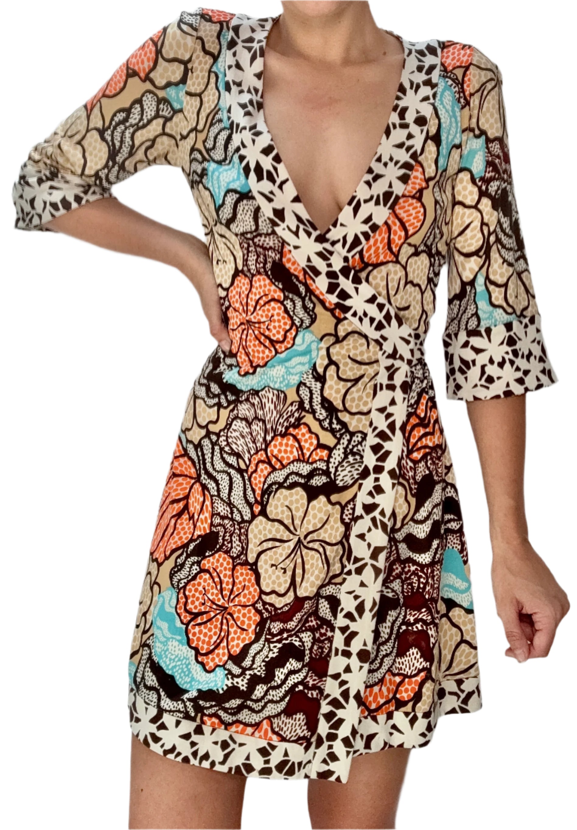 Woman wearing a patterned dress with a plain background