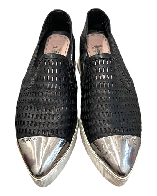 Pre-loved Miu Miu leather platform loafers. Shoes feature a leather mesh body with a silver-toned metal toe tip. Platform is approximately 2 inches in height. 