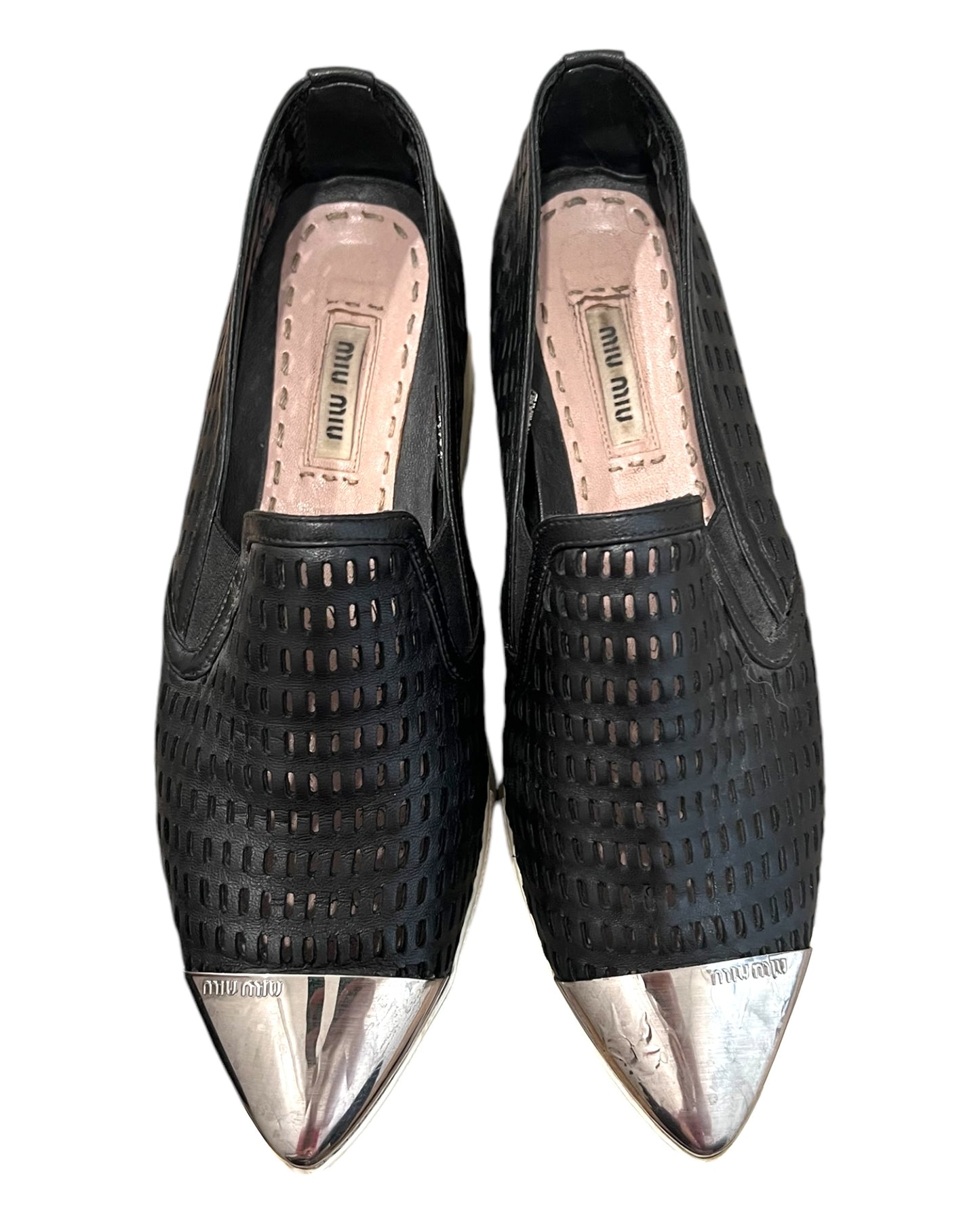 Pre-loved Miu Miu leather platform loafers. Shoes feature a leather mesh body with a silver-toned metal toe tip. Platform is approximately 2 inches in height. 