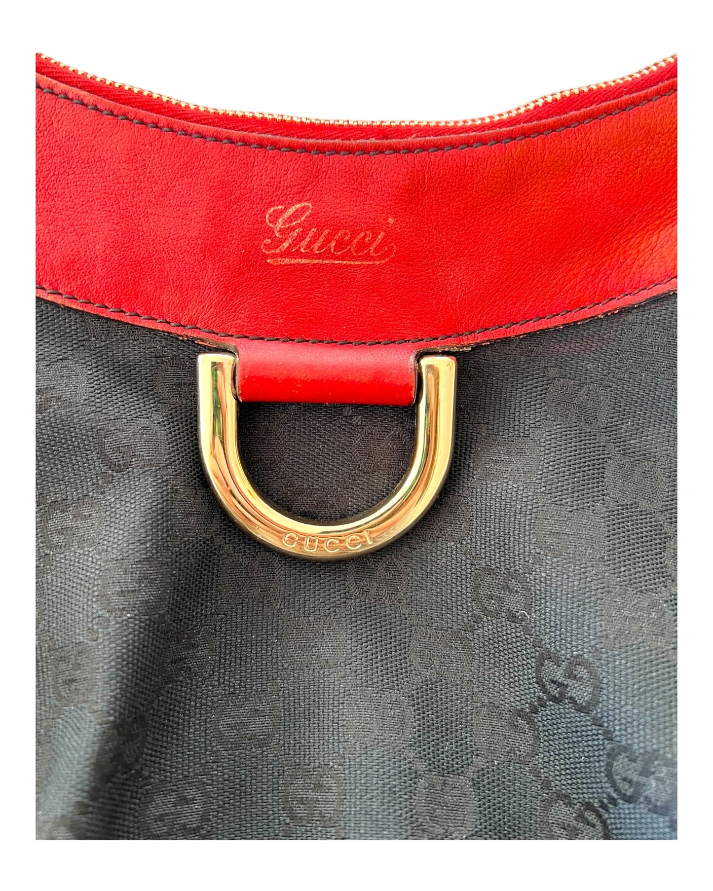 Vintage Gucci Red and Black Logo Abbey Tote Bag. Bag Features a black canvas body with the GG Logo throughout and red leather trim with metal hardware. 