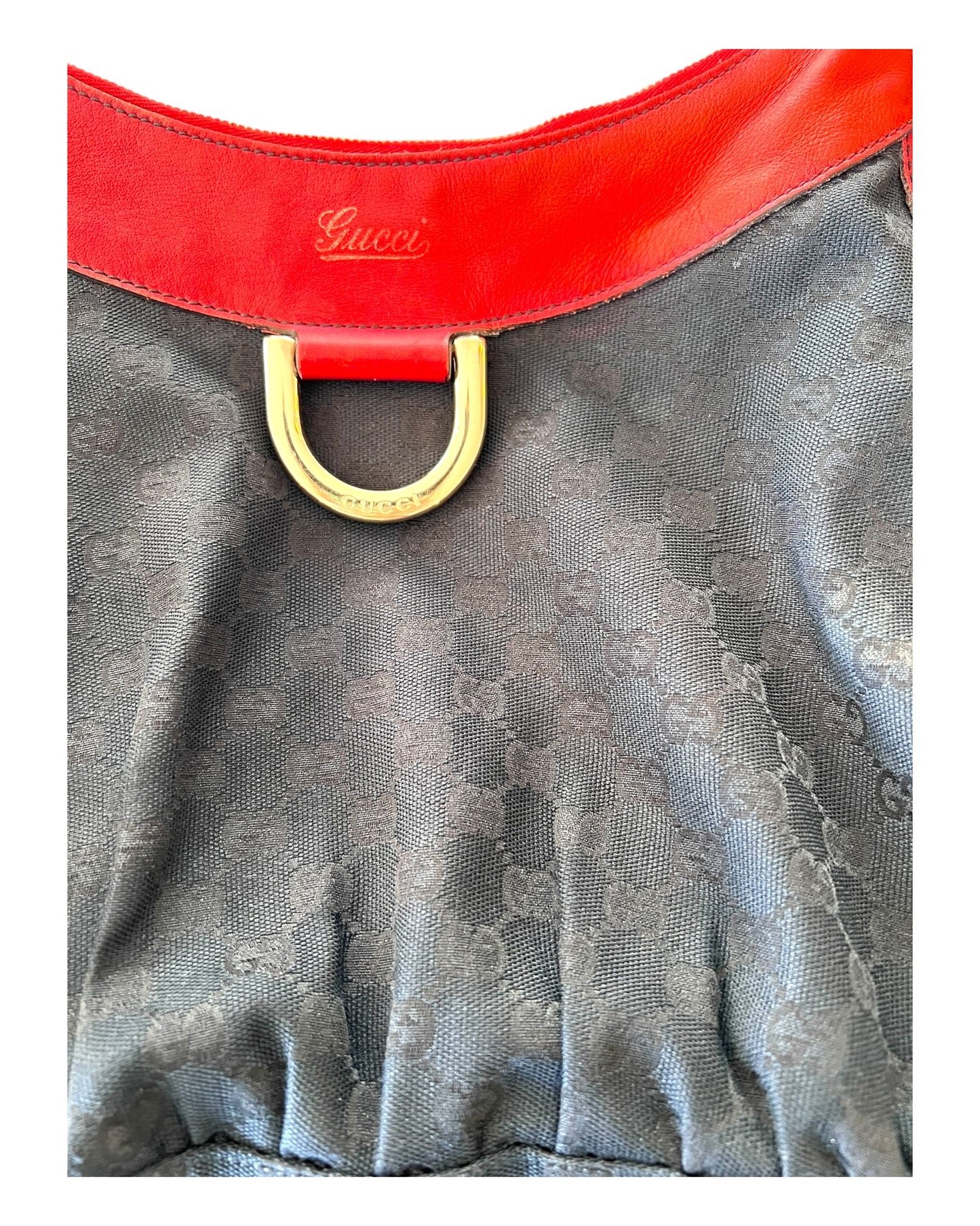 Vintage Gucci Red and Black Logo Abbey Tote Bag. Bag Features a black canvas body with the GG Logo throughout and red leather trim with metal hardware. 