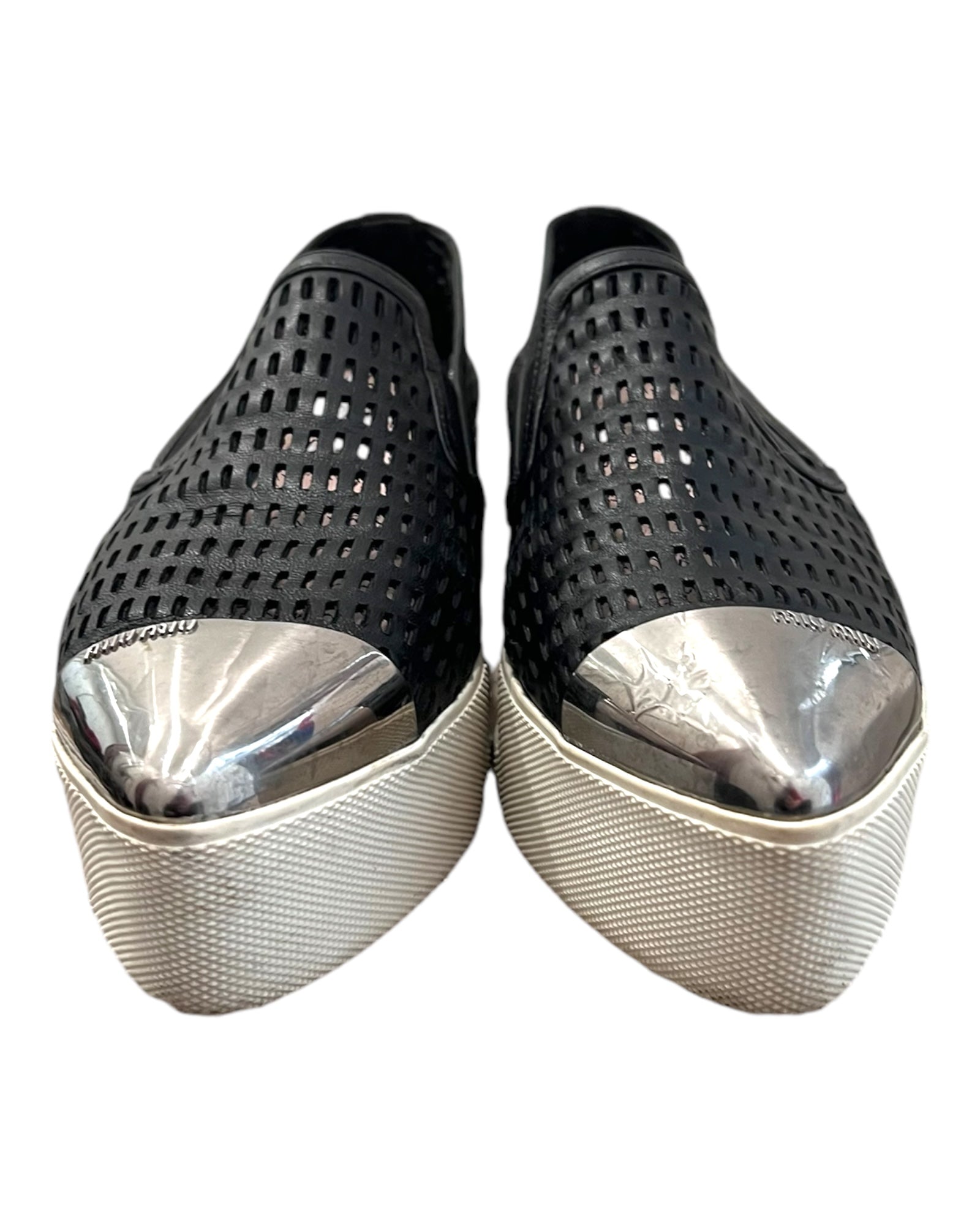 Pre-loved Miu Miu leather platform loafers. Shoes feature a leather mesh body with a silver-toned metal toe tip. Platform is approximately 2 inches in height. 