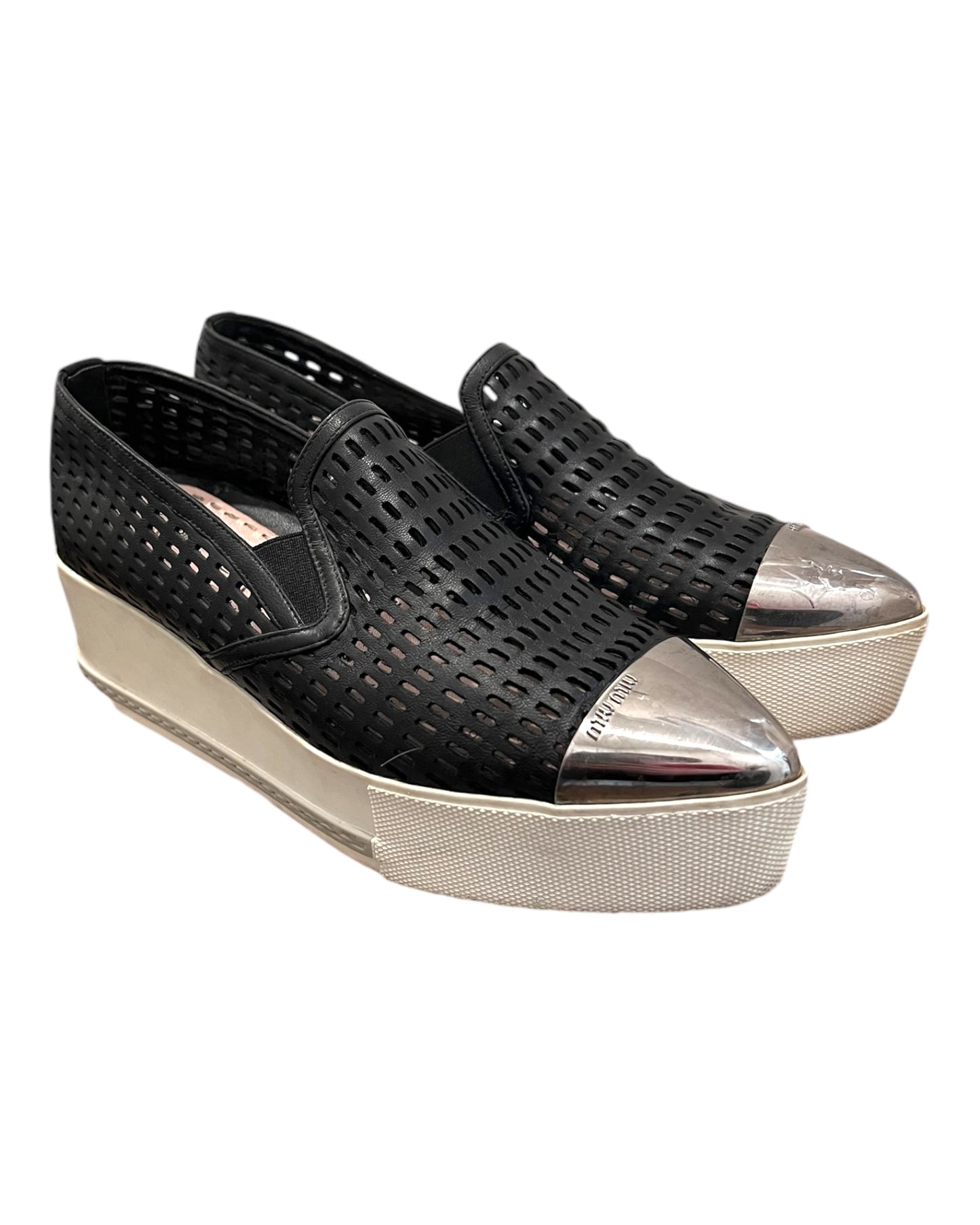 Pre-loved Miu Miu leather platform loafers. Shoes feature a leather mesh body with a silver-toned metal toe tip. Platform is approximately 2 inches in height. 