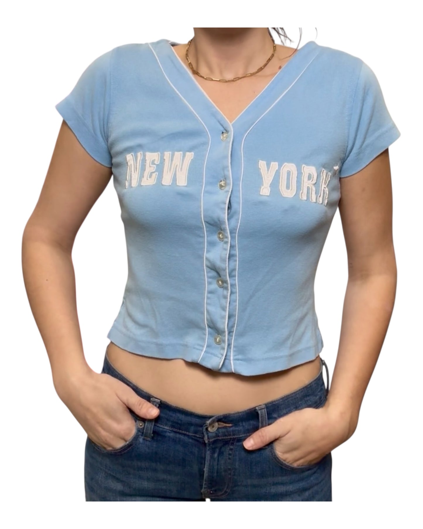 Light blue denim crop top with 'New York' text worn by a person on a white background