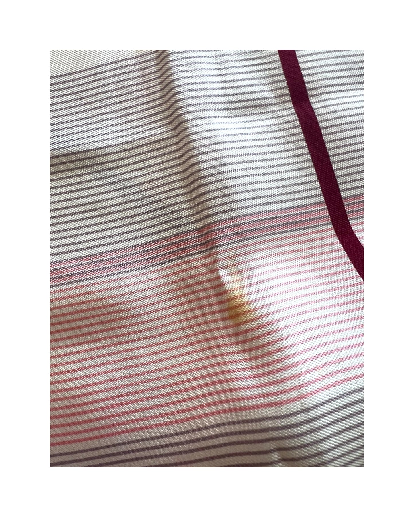 Vintage Yves Saint Laurent Pink Multicolor Plaid Silk Scarf. colors are maroon, pink, blue, beige, grey and white. Image shows small spot on scarf. 