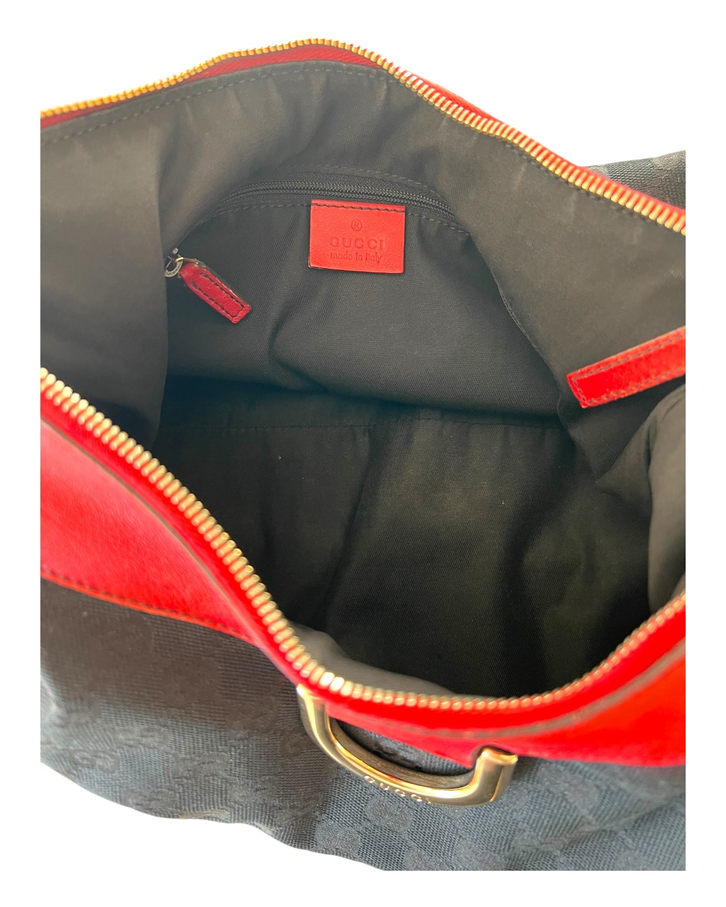 Vintage Gucci Red and Black Logo Abbey Tote Bag. Bag Features a black canvas body with the GG Logo throughout and red leather trim with metal hardware. 