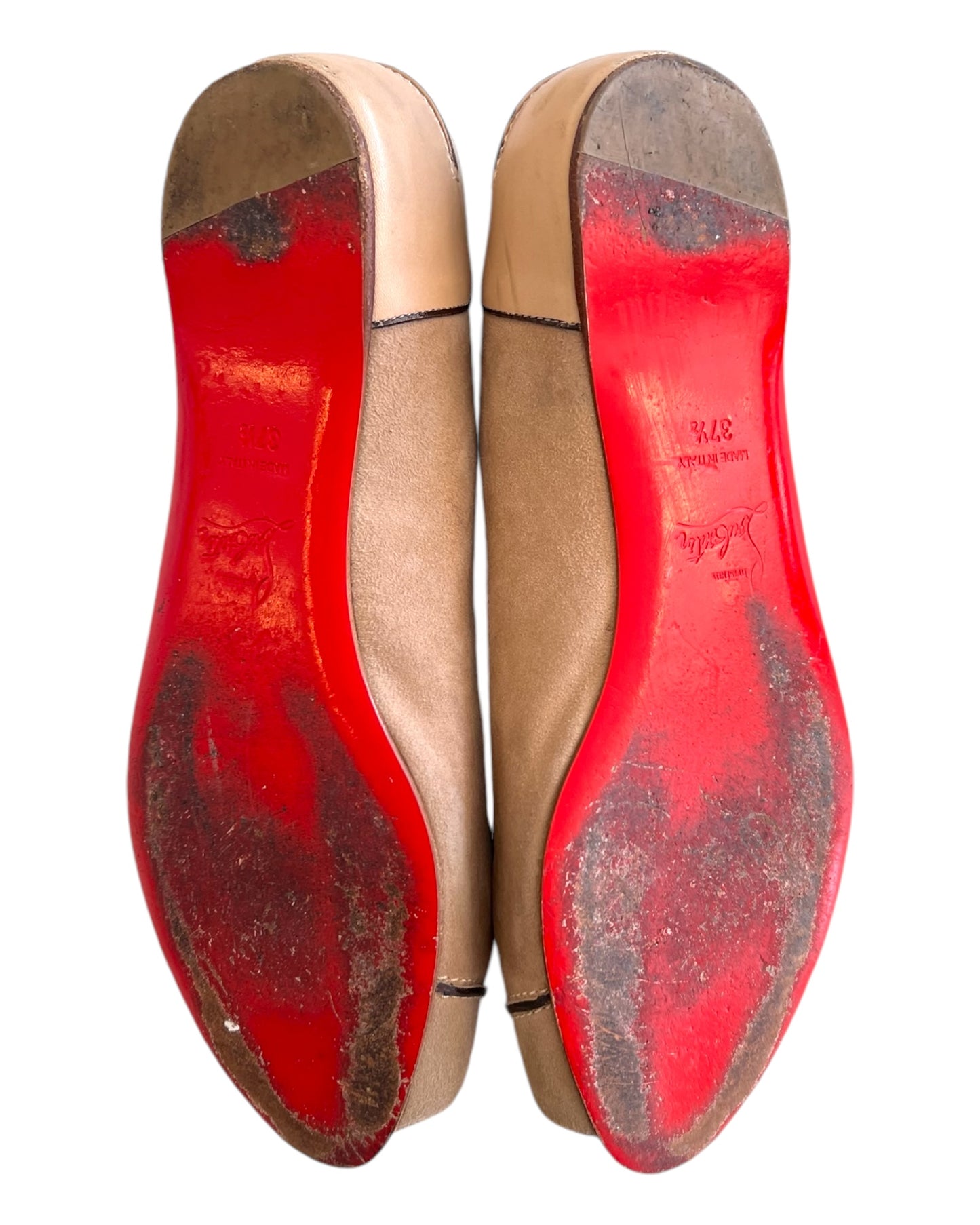 Vintage Christian Louboutin Biege Suede Peep-toe Flats. features darker brown leather details throughout with white stitching. Image depicts the bottom of the shoes, showing heavy wear. 