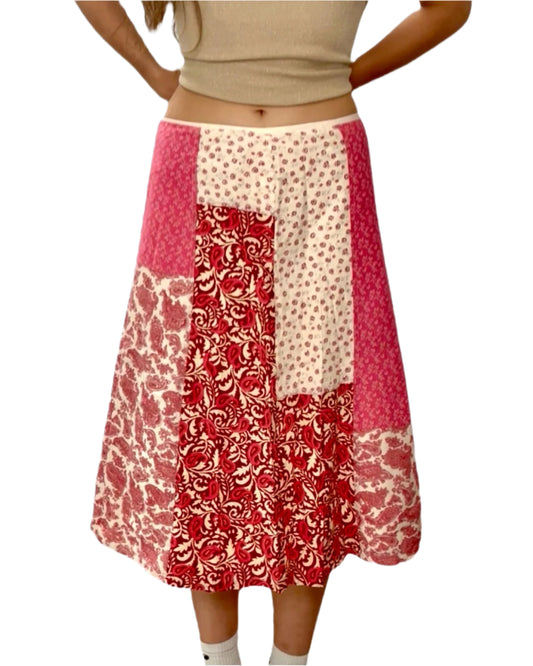 Woman wearing a patterned skirt on a white background