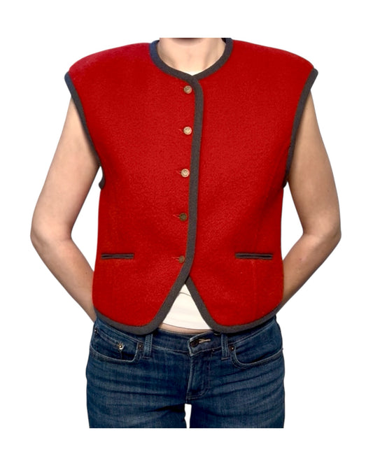 Red vest with black trim worn by a person on a white background